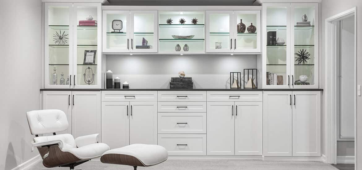 White cabinets with custom LED lighting and glass shelves. Unique space solutions by Complete Closet Design. | Closet Solutions