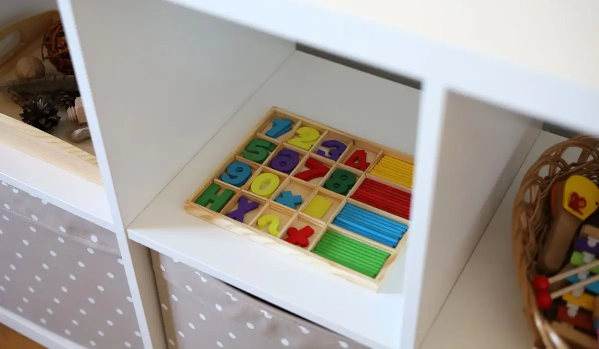 shelves with kids toys on a Playroom Storage organization
