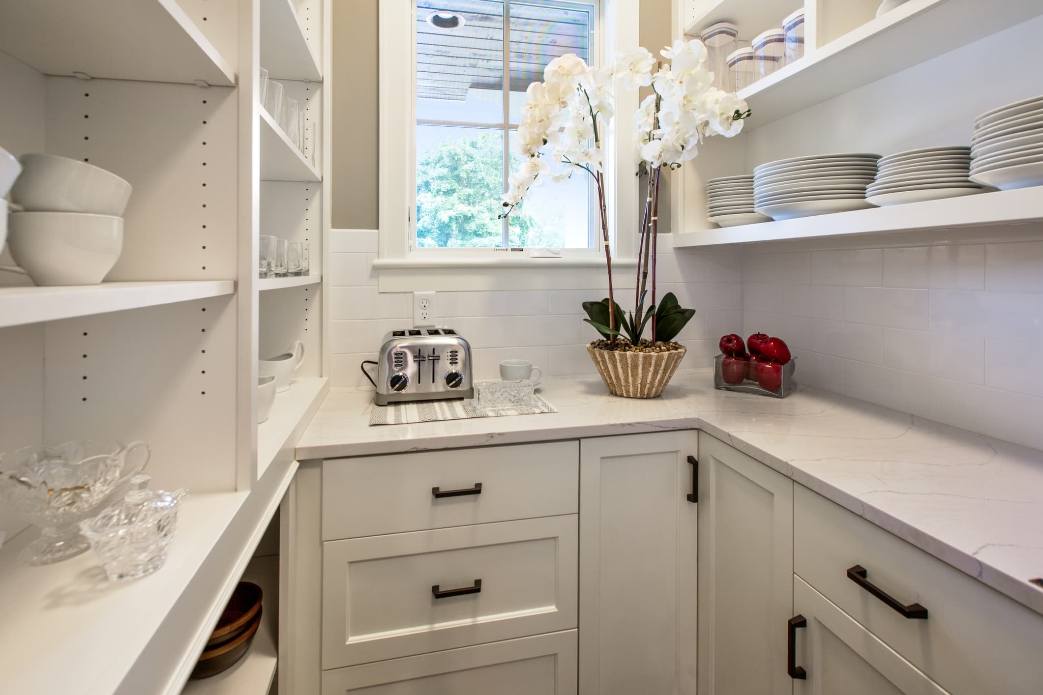 Kitchen Pantry Cabinets - a white cabinets and shelves with white plates and bowls