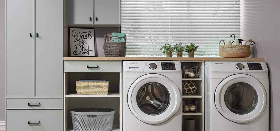 A laundry room with a closet and a washing machine
